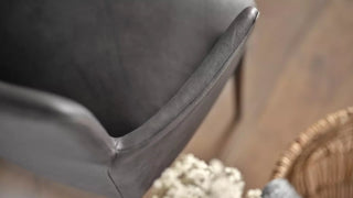 Detail of the black leather armrest of a Mobitec Rob chair