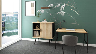 Lifestyle image of a low Buronomic Alto hinged door cabinet in black and Nebraska against a green wall
