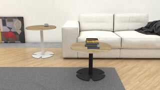 Buronomic Guest round coffee table in black and Nebraska next to a round reception table in white and Nebraska